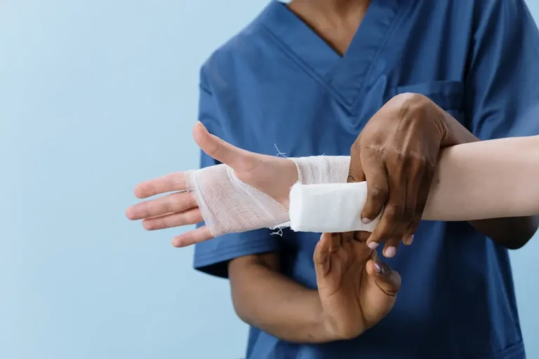 Picture of a nurse applying a bandage to someone as they wonder what is a personal injury lawyer?